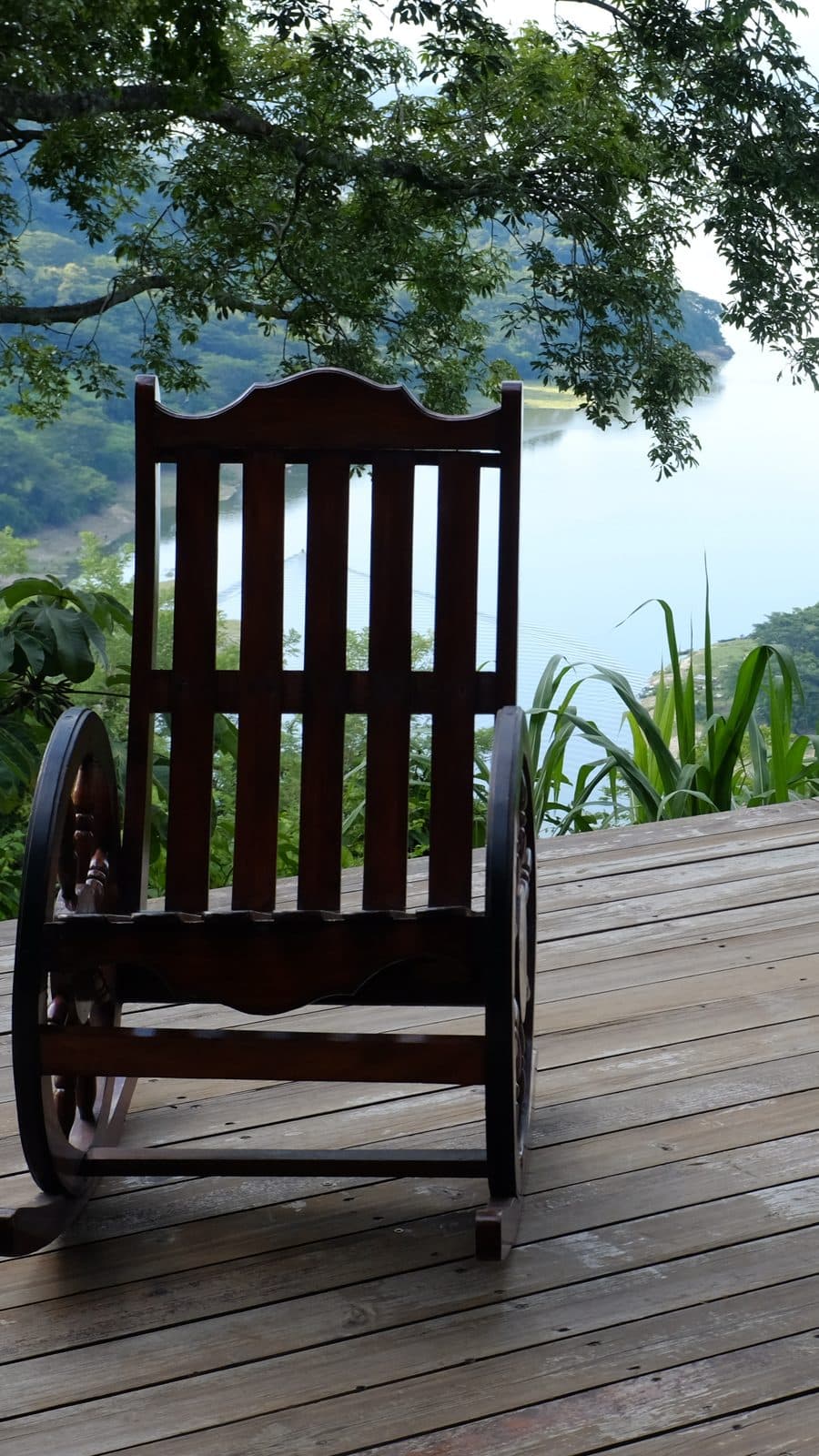 Rocking chair on a wooden deck overlooking Lake Suchitlán